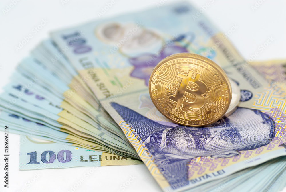 bitcoin concept coin and stack of romanian currency ron leu over white background bitcoin concept coin and stack of romanian currency ron leu over white background