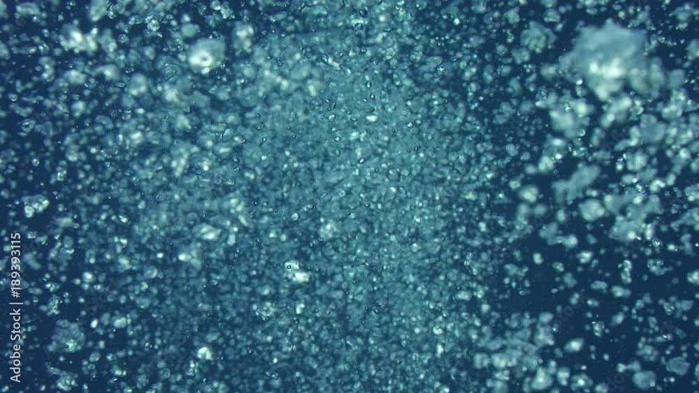 Rising bubbles with light reflections underwater, Indonesia, slow motion Rising bubbles with light reflections underwater, Indonesia, slow motion