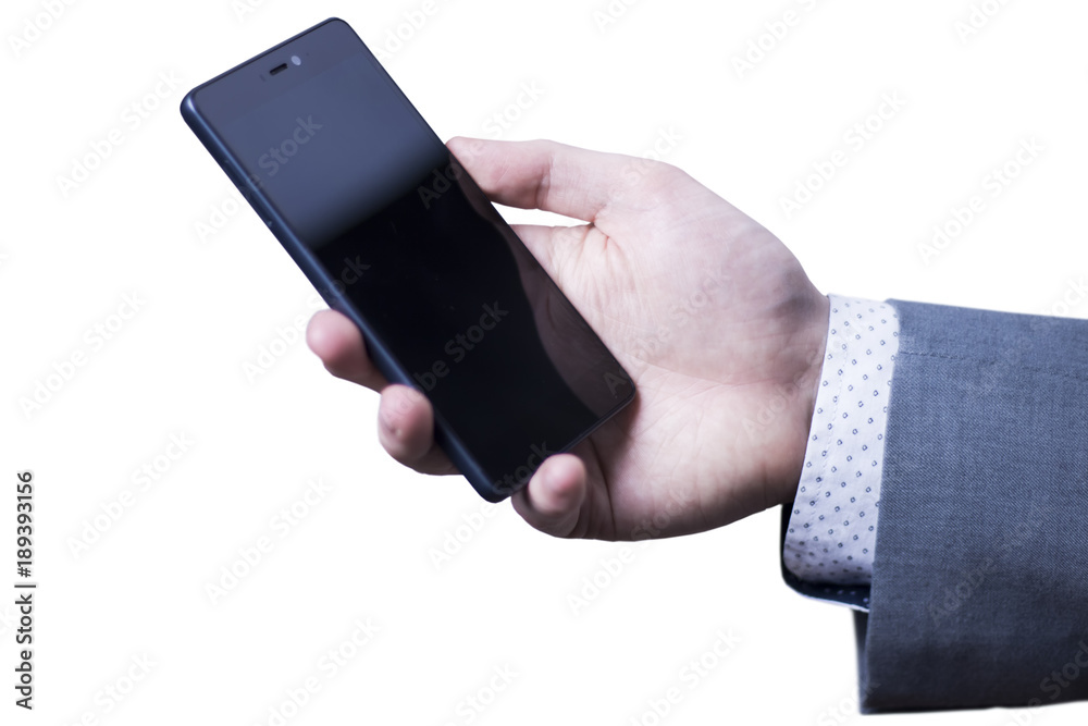 Closeup of a hand of businessman in grey suit holding mobile phone. Closeup of a hand of businessman in grey suit holding mobile phone.