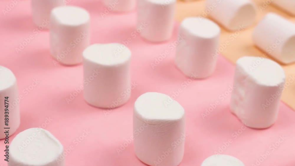 Sweet marshmallows on pastel yellow and pink background. Sweet marshmallows on pastel yellow and pink background.