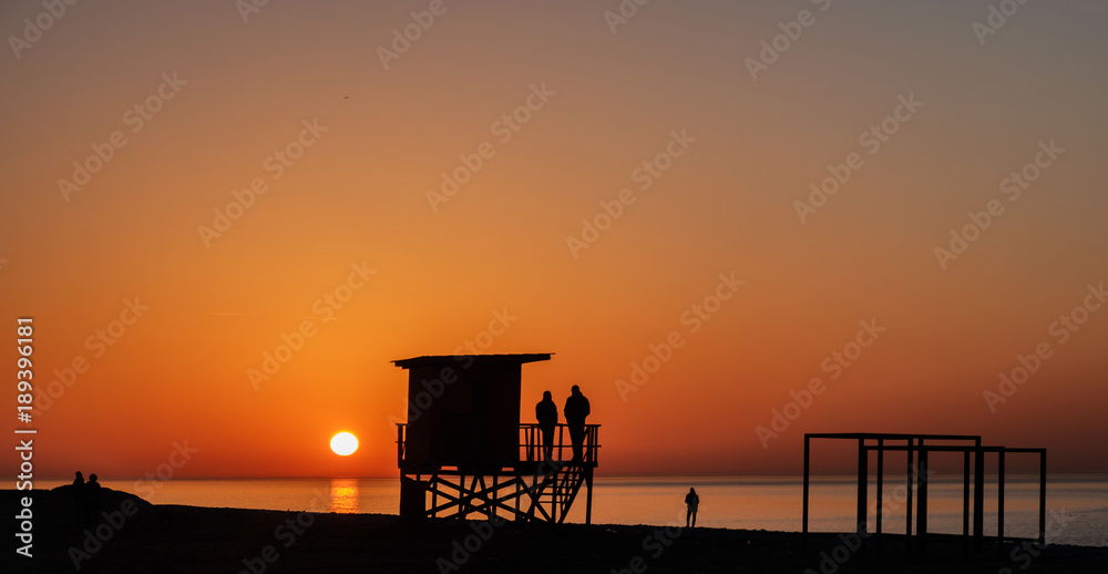  lifeguard tower silhouette on the sunset beach