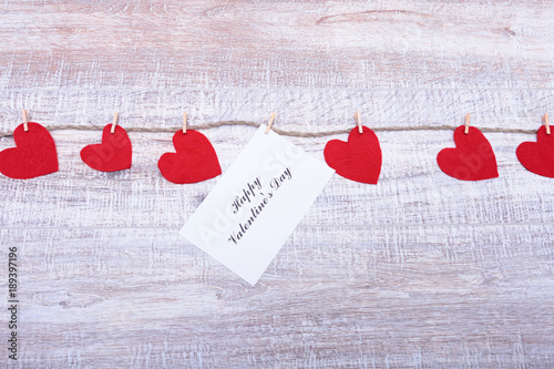 Red hearts on wooden background.Valentines day greeting card.Top view with copy space photo