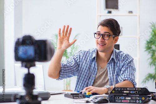 Wallpaper Mural Vlogger recording computer repair on camera for vlog blog Torontodigital.ca