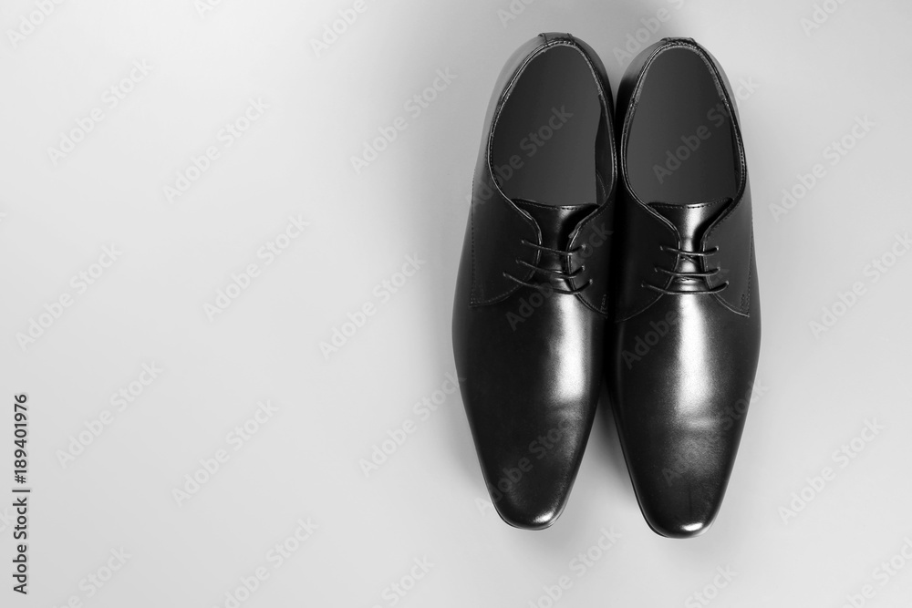 Elegant leather men's shoes on grey background, top view