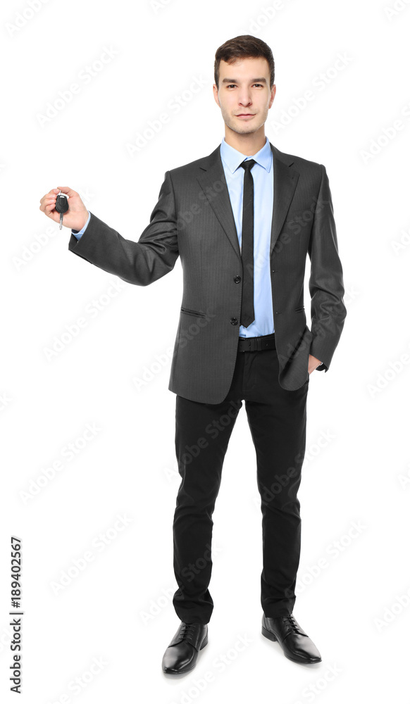 Handsome car salesman with key on white background Handsome car salesman with key on white background