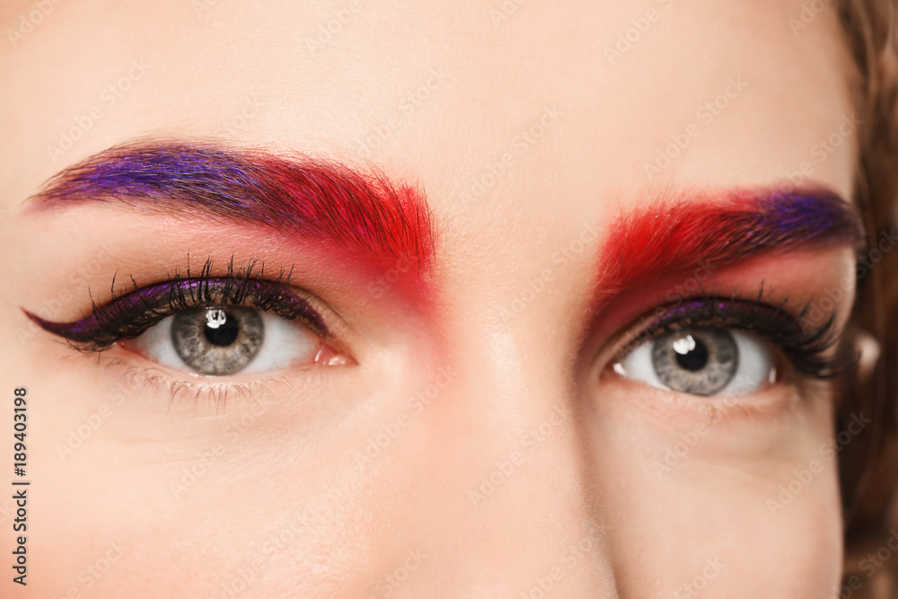 Naklejka premium Young woman with dyed eyebrows, closeup
