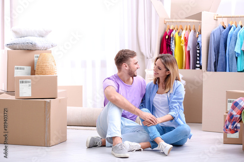 Young couple resting near w...
