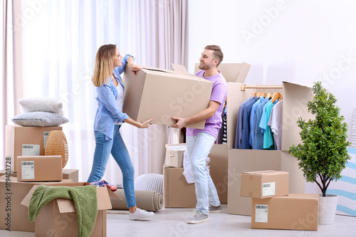 Young couple with wardrobe ...