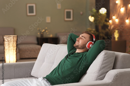 Young man listening to musi...