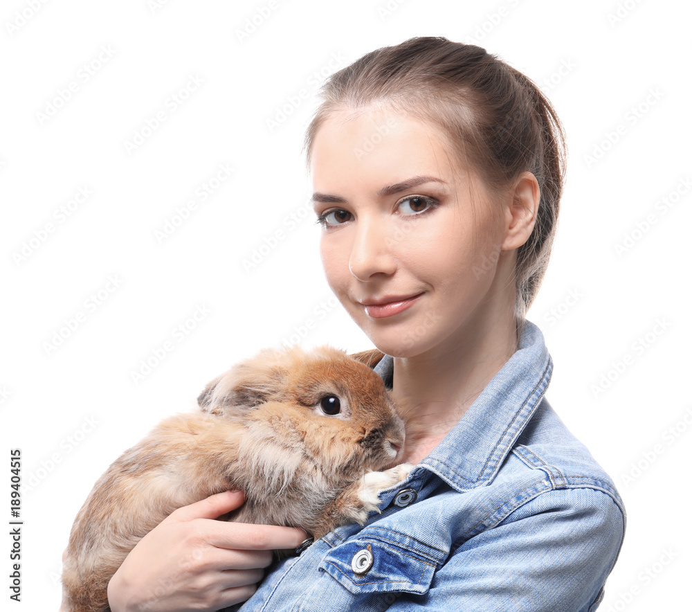 Beautiful young woman with pet rabbit on white background Beautiful young woman with pet rabbit on white background
