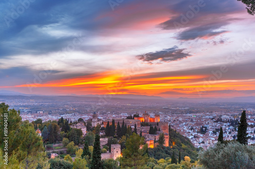 Palace and fortress complex Alhambra with Iglesia de Santa Maria, Palacios Nazaries and Alcazaba during sunset in Granada, Andalusia, Spain © Kavalenkava