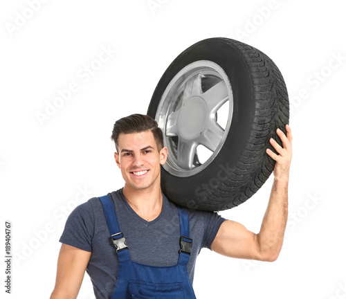 Young mechanic in uniform w...