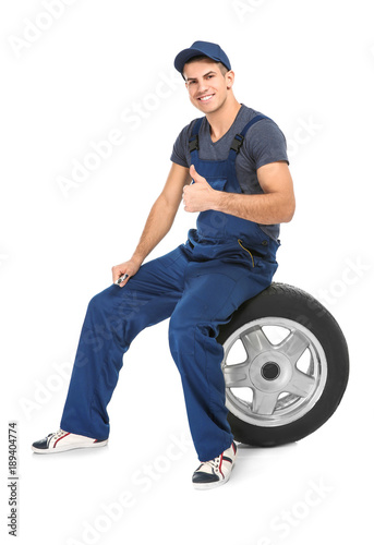 Young mechanic in uniform w...
