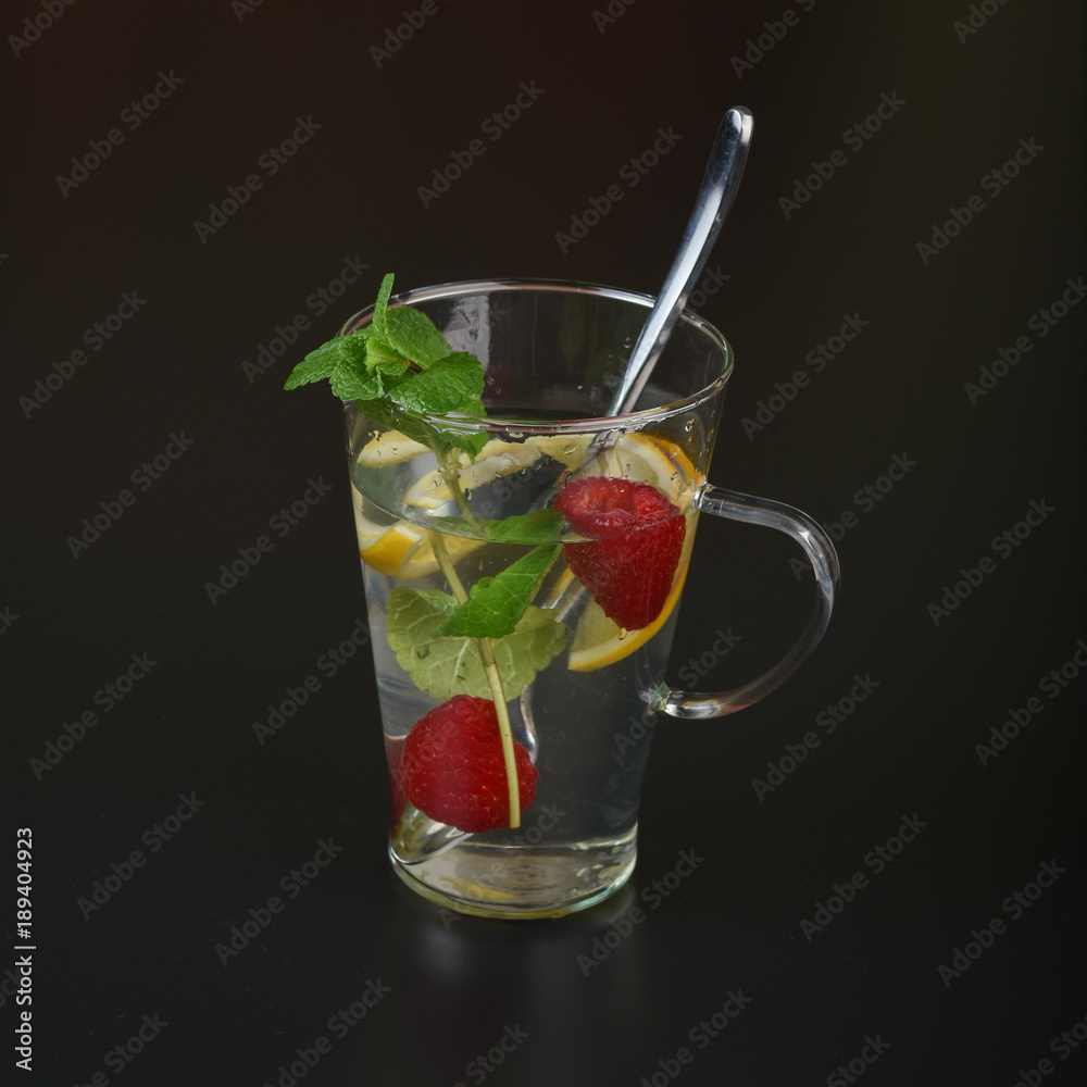 still life of fresh fruits and herbs on a dark background close up still life of fresh fruits and herbs on a dark background close up