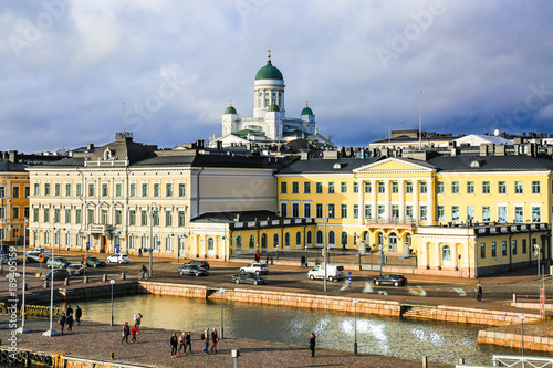 Panorama of Helsinki, Finland. Aerial view of downtown city. Famous Lutheran Helsinki Cathedral and Market square in evening light, cloudy sky, horizon, autumn skyline. photo