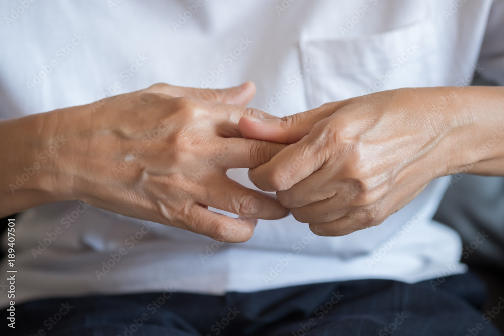 Elderly woman suffering from pain From Rheumatoid Arthritis