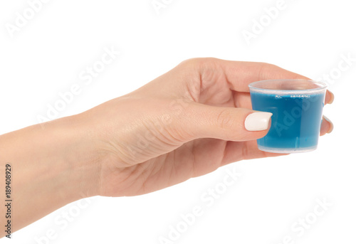Mouthwash in han on white background isolation