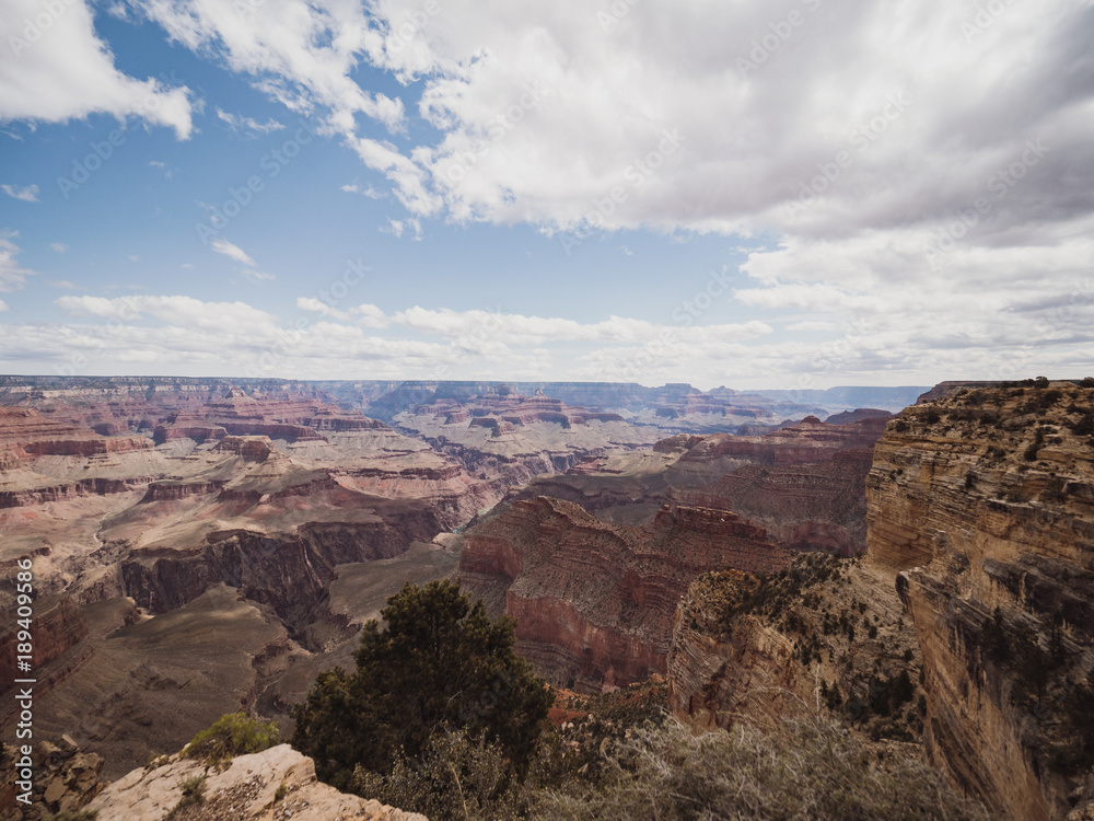 Panoramic view over Grand Canyon National Park in Arizona, USA, on a sunny and cloudy day Panoramic view over Grand Canyon National Park in Arizona, USA, on a sunny and cloudy day