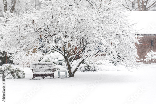 Outdoor furniture covered with snow