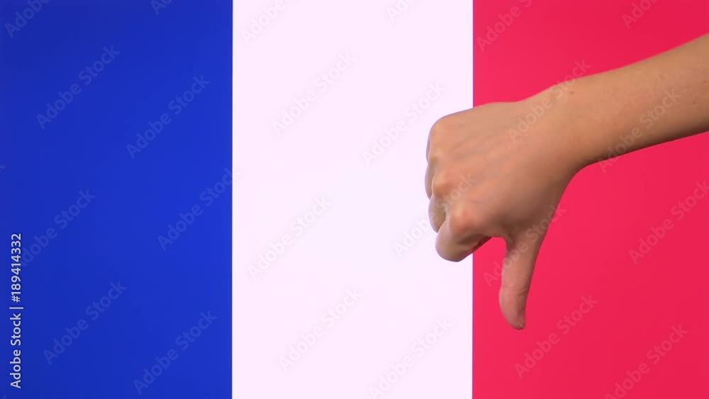 Hand giving thumb down with France flag disapproval gesture with copy space. Negative opinion sign, concept of contempt for French nation banner background, disliking symbol with blank field Hand giving thumb down with France flag disapproval gesture with copy space. Negative opinion sign, concept of contempt for French nation banner background, disliking symbol with blank field