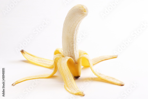 Peeled banana isolated over white background