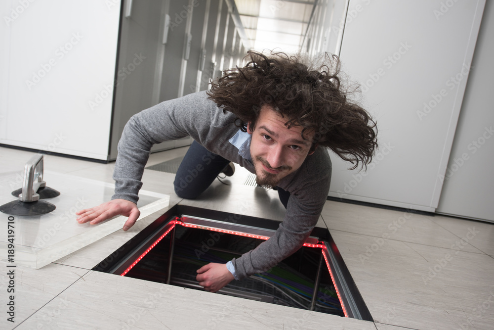 © .shock - engineer connecting cables in server room