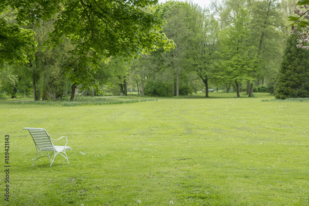 Great park with white chair to relaxe and dream Great park with white chair to relaxe and dream