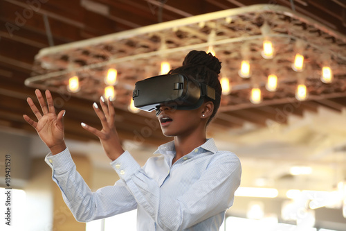 Excited black girl in VR glasses