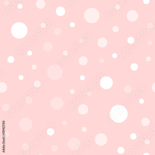 White polka dots seamless pattern on pink background. Exceptional classic white polka dots textile pattern in restrained colours. Seamless scattered confetti fall chaotic decor. Vector illustration.