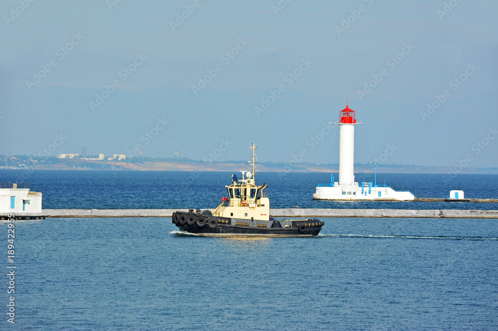 Tugboat and lighthouse