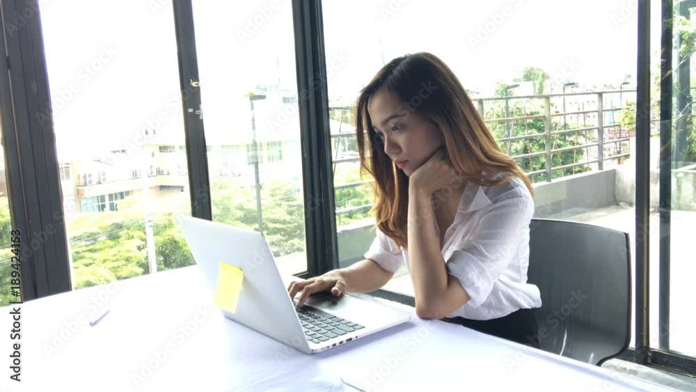 Asia girl use laptop emotion edgy or busy or anxiety due to work or education. Asia girl use laptop emotion edgy or busy or anxiety due to work or education.