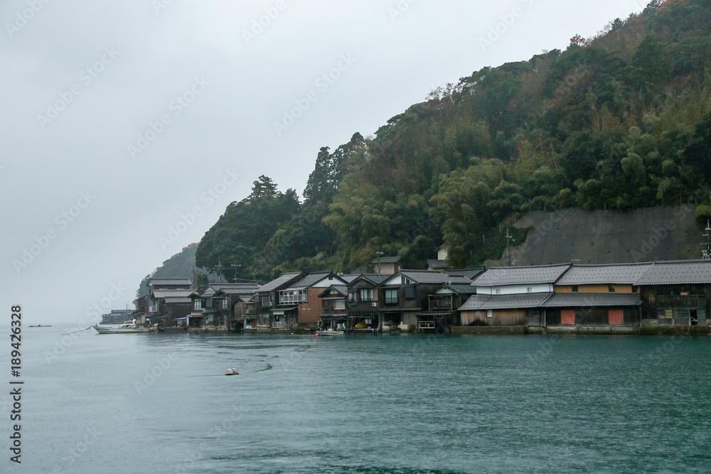 Ine Boathouse is traditional Fisherman Village on a rainy day of Kyoto, JAPAN.