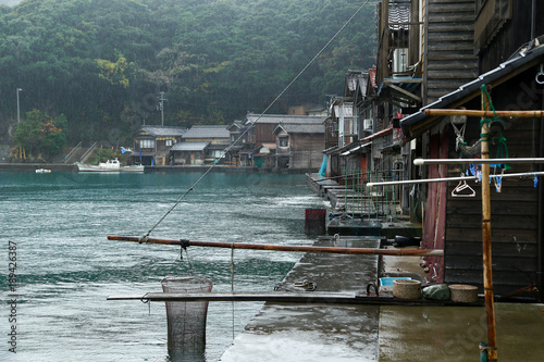 Ine Boathouse is traditional Fisherman Village on a rainy day of Kyoto, JAPAN. photo