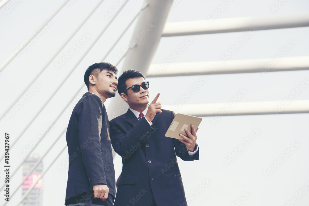 Handsome Businessman work together. Business concept. Handsome Businessman work together. Business concept.