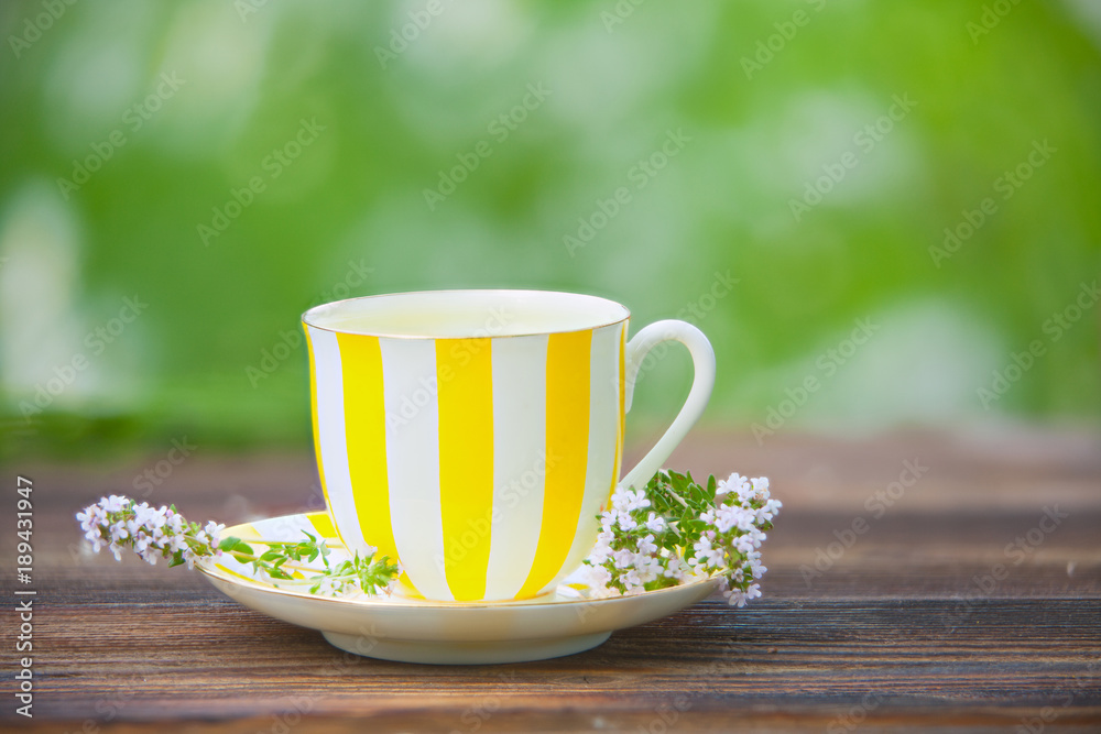 porcelainl cup with green tea on table porcelainl cup with green tea on table