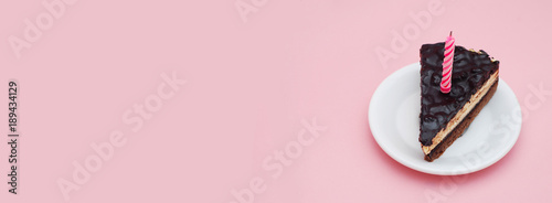 Pink Baner with Chocolate Cake on Pink Background with Copy Paste for Text. photo