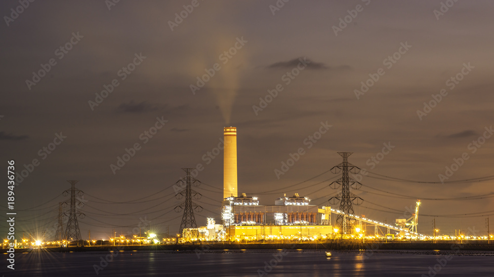 Fototapeta premium power plant by the sea in twilight view