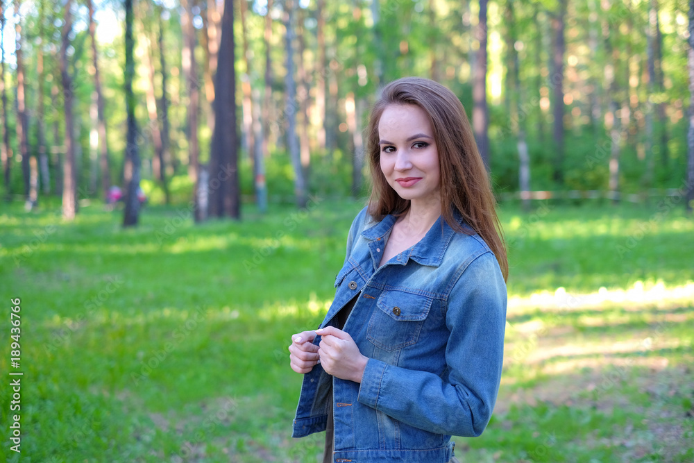 Woman smiling with perfect smile in a park and looking at camera Woman smiling with perfect smile in a park and looking at camera