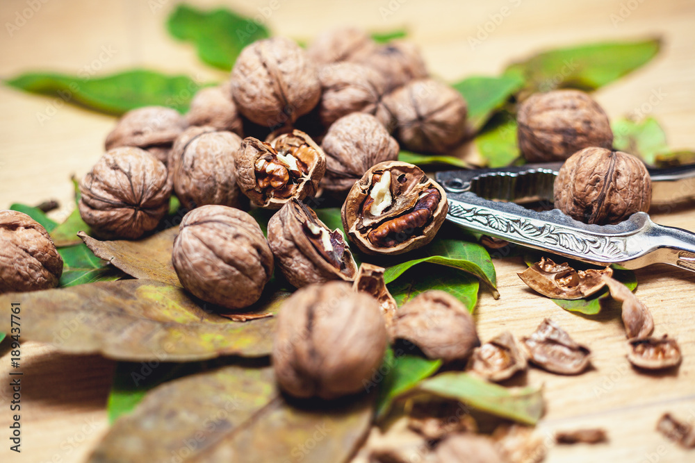 Several walnut kernels and lie on brown background Several walnut kernels and lie on brown background