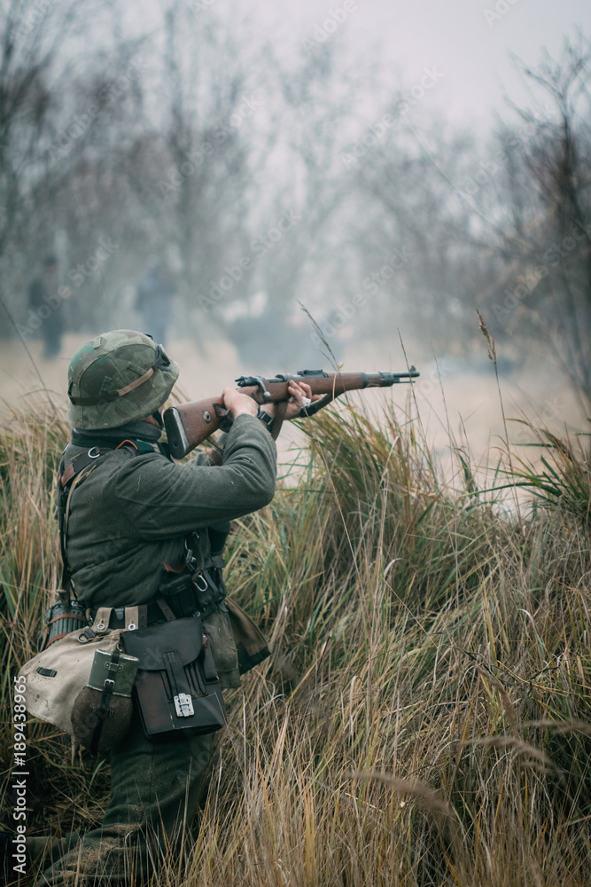 Fototapeta premium Soldier Wehrmacht shoots with a rifle