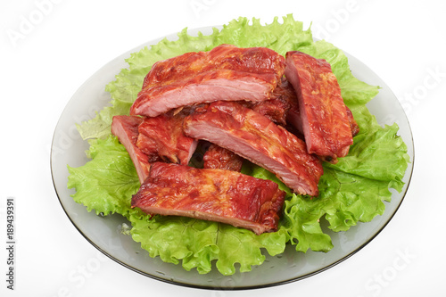 Close up grilled pork rib on the plate isolated on white background