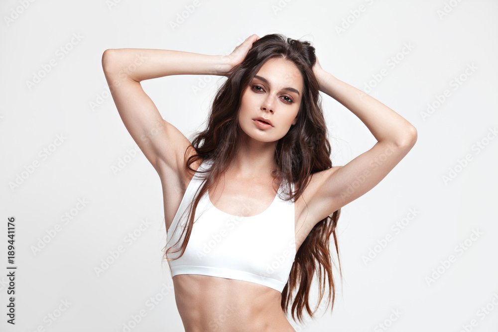 Fototapeta premium Sexy young woman in underwear on white background