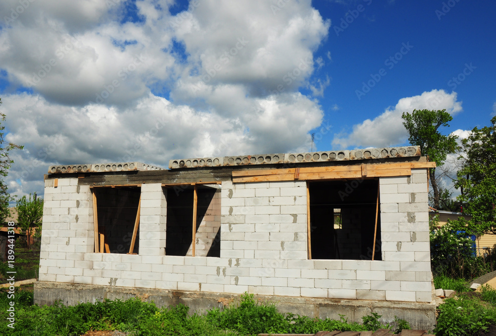 Unfinished house with autoclaved aerated concrete blocks, white blocks wall. Unfinished house with autoclaved aerated concrete blocks, white blocks wall.