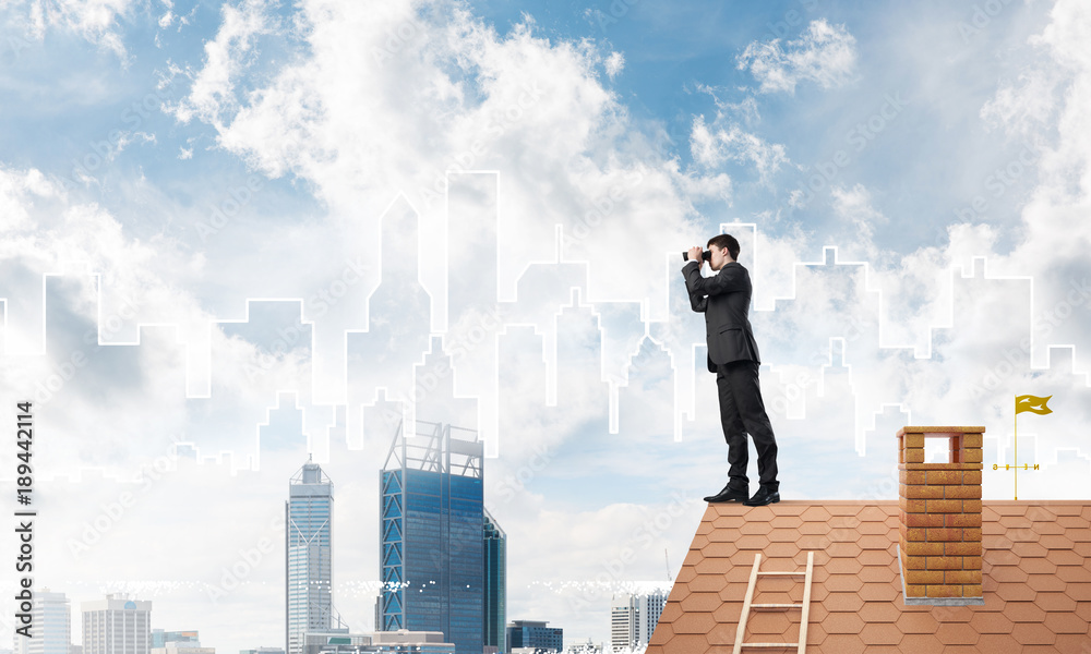 Businessman standing on roof and looking in binoculars. Mixed media Businessman standing on roof and looking in binoculars. Mixed media