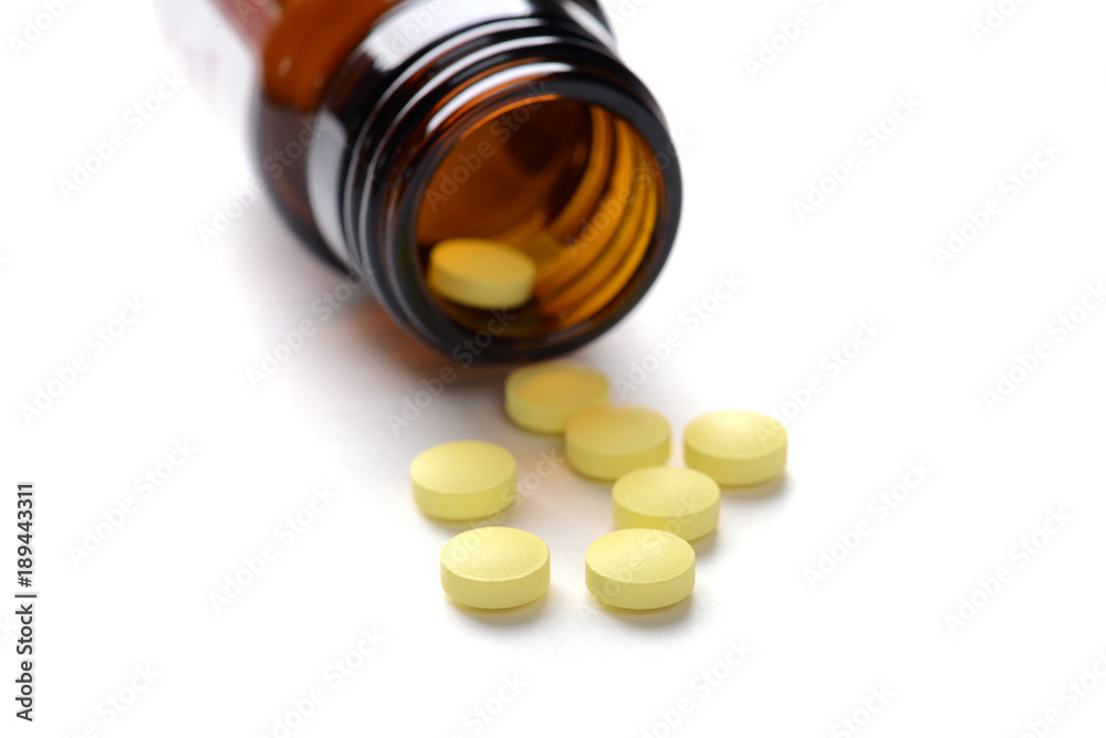 Pills with bottle on white background Pills with bottle on white background