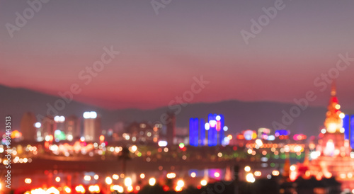 Photography Abstract background from blurred business city center light at night with bokeh