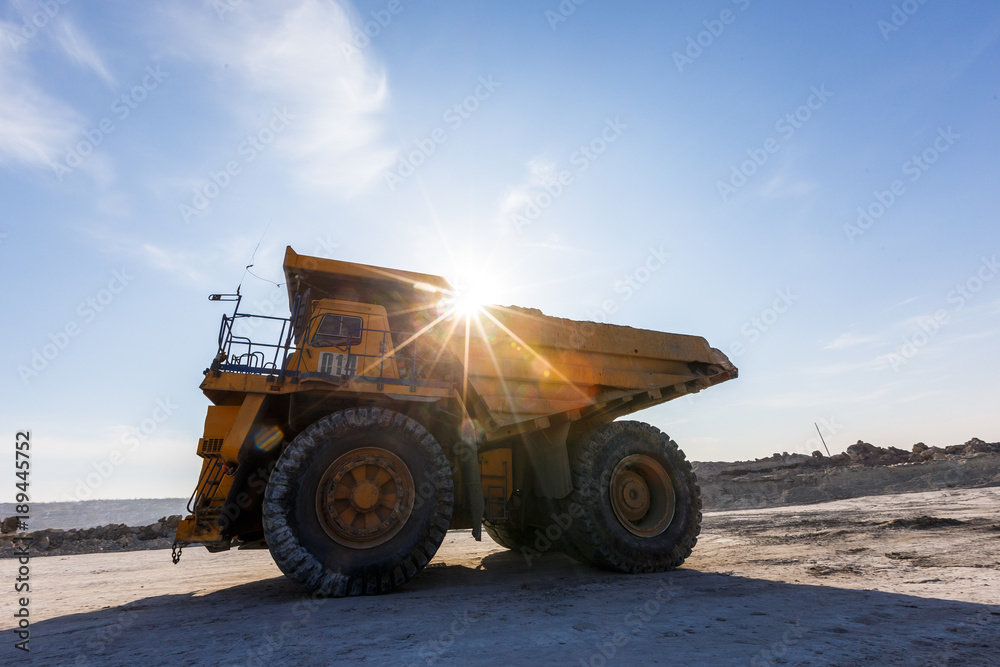 Primorsky Krai, Russia - March 2017: a large dump truck loaded with rocks. BelAZ. dense morning fog Primorsky Krai, Russia - March 2017: a large dump truck loaded with rocks. BelAZ. dense morning fog