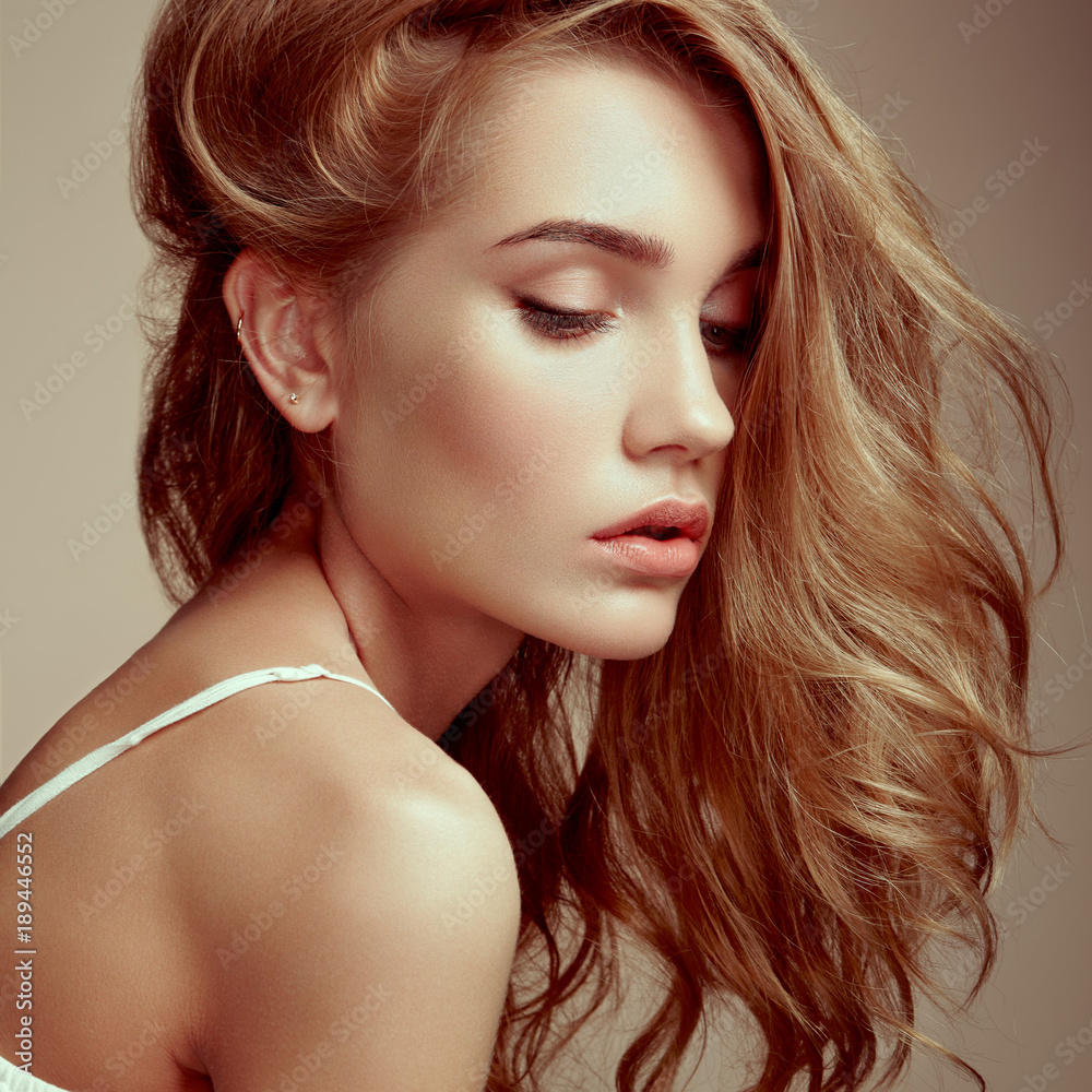 Fototapeta premium Portrait of young beautiful girl with blonde hair. Fashion photo Hairstyle. Make up. Vogue Style