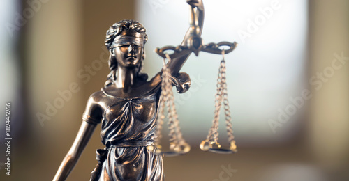 Law and Justice concept. Mallet of the judge, books, scales of justice.  Courtroom theme.