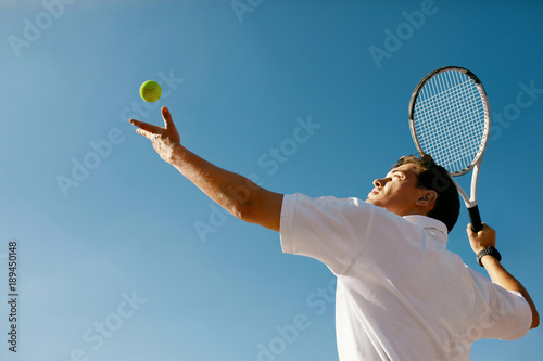 Tennis Sport. Man Playing Tennis Outdoors © puhhha